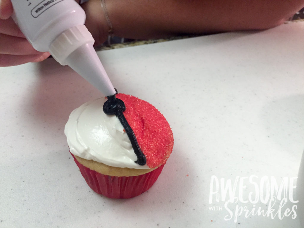 Poké Ball Cupcakes by Awesome with Sprinkles | Step 5: dollup of frosting