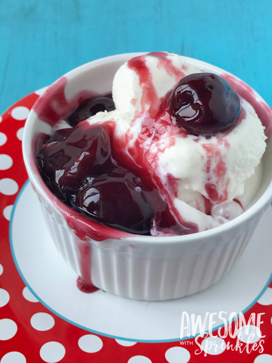 This delightful Rum Cherry Sauce made with fresh whole cherries is perfect for topping cheesecake, ice cream, pancakes and more! | Awesome with Sprinkles