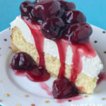 Vanilla bean cheesecake with homemade rum cherry sauce made with fresh whole cherries is the classic dessert! | Awesome with Sprinkles