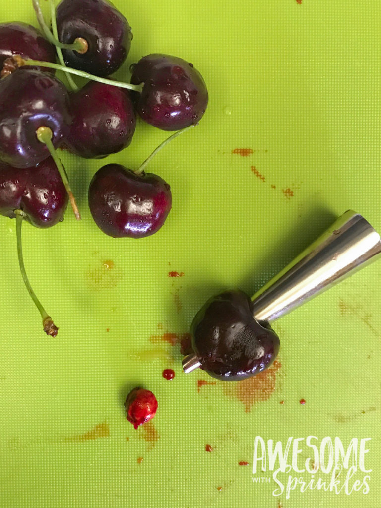 This delightful Rum Cherry Sauce made with fresh whole cherries is perfect for topping cheesecake, ice cream, pancakes and more! | Awesome with Sprinkles