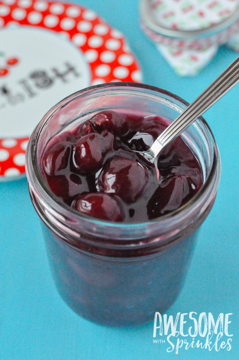 This delightful Rum Cherry Sauce made with fresh whole cherries is perfect for topping cheesecake, ice cream, pancakes and more! | Awesome with Sprinkles